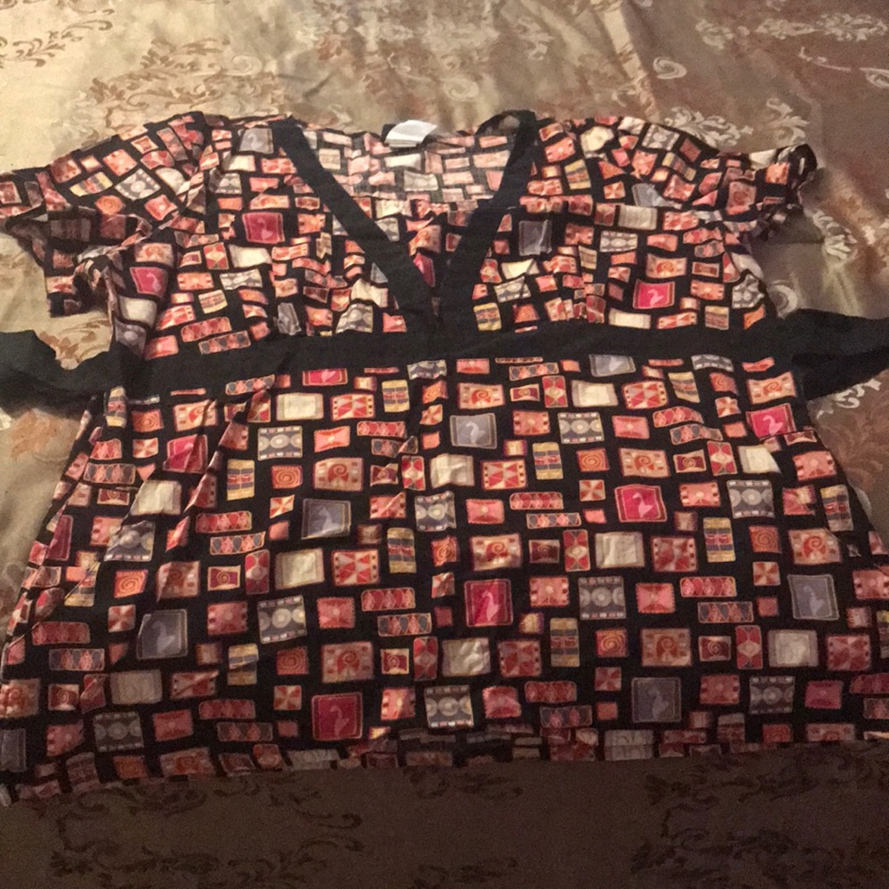 Multi colored scrub top with black strap